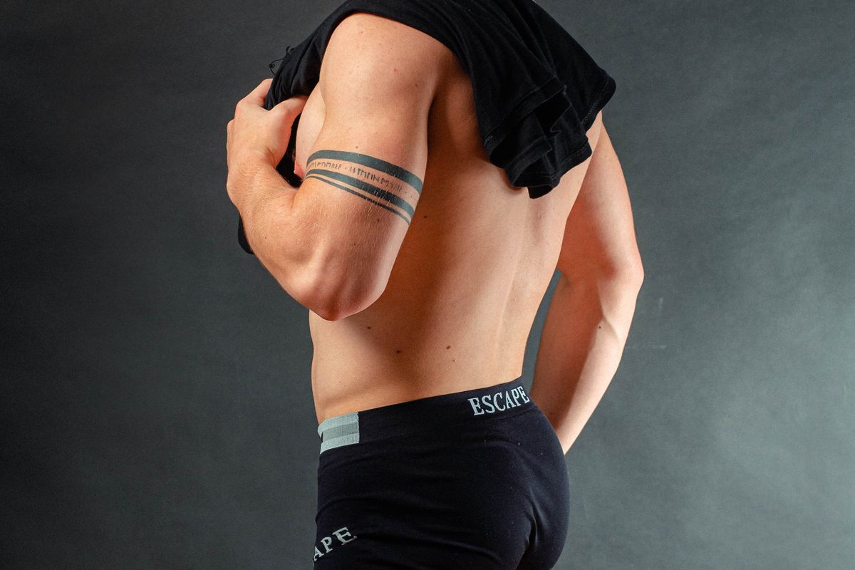 Folded cotton and knit underwear in neutral colours stacked on a shelf