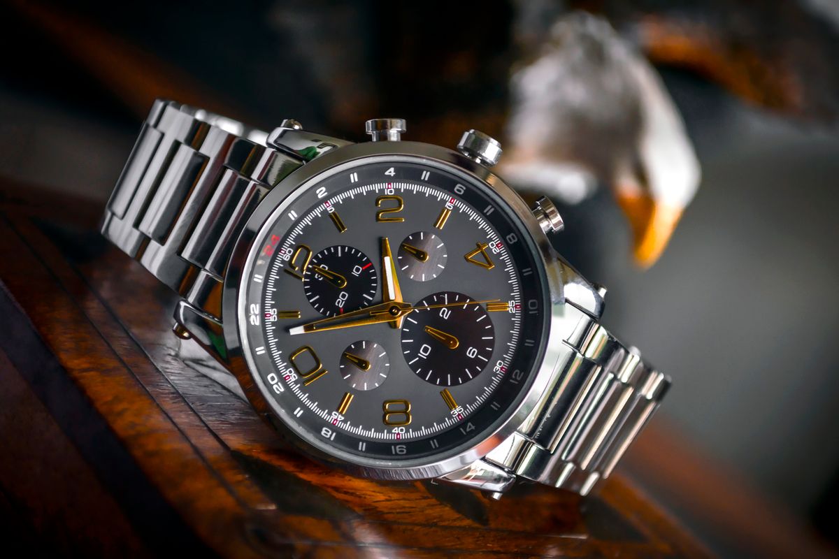 A wristwatch lying flat with its dial facing upward